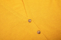 Evolve merino cardigan in golden rod, close up view 